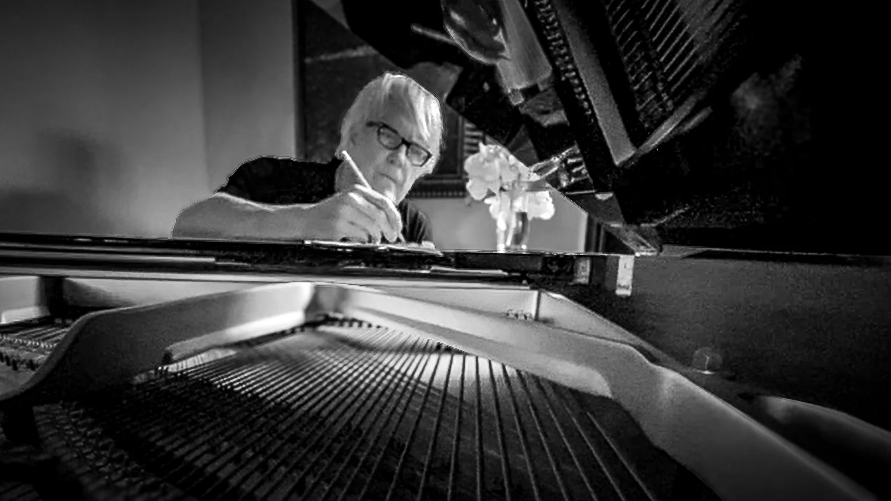 John Tesh at the piano in his recording studio