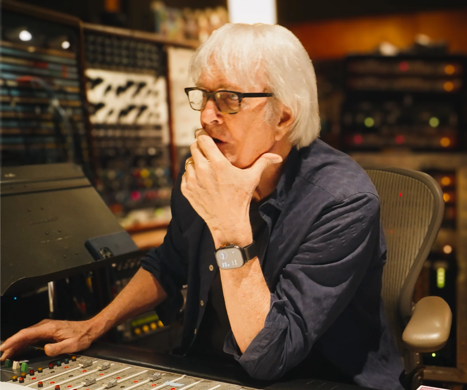 John Tesh listening in the recording studio
