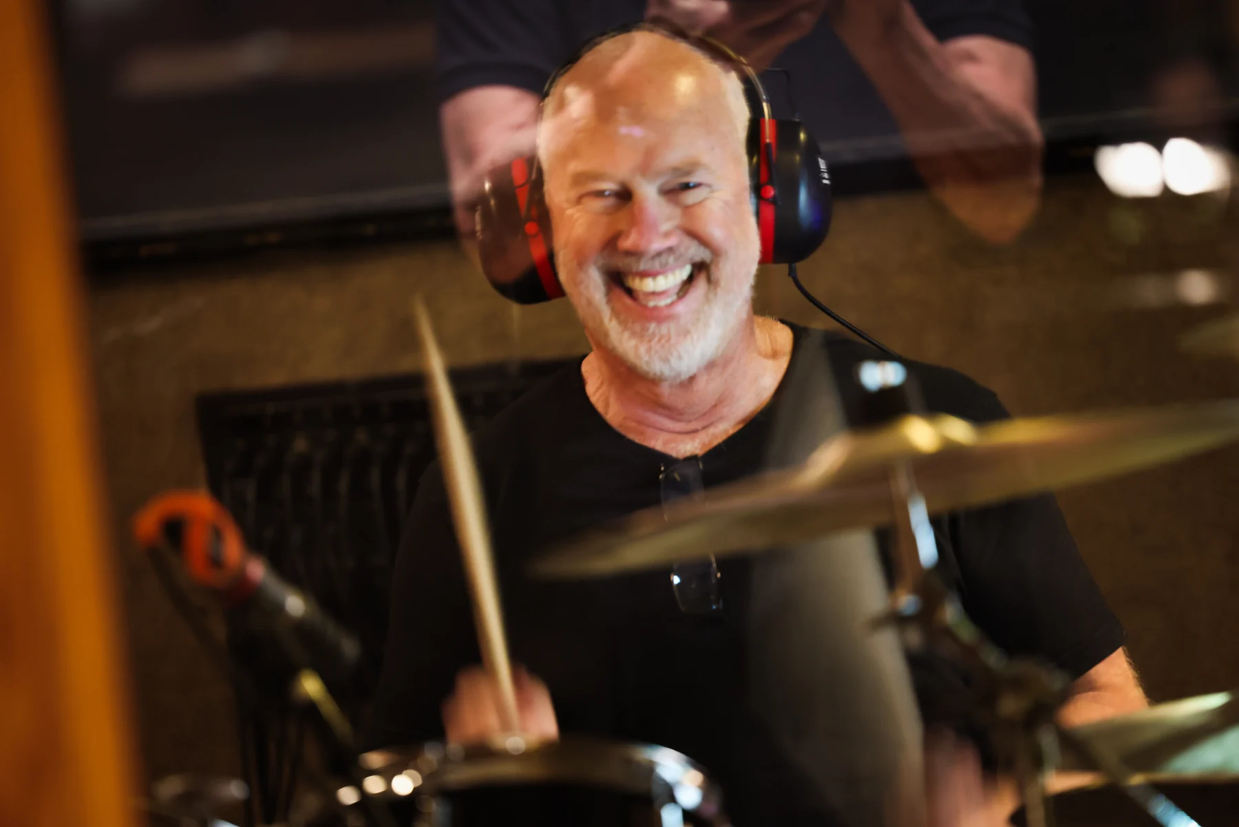 Drummer smiling during a recording session